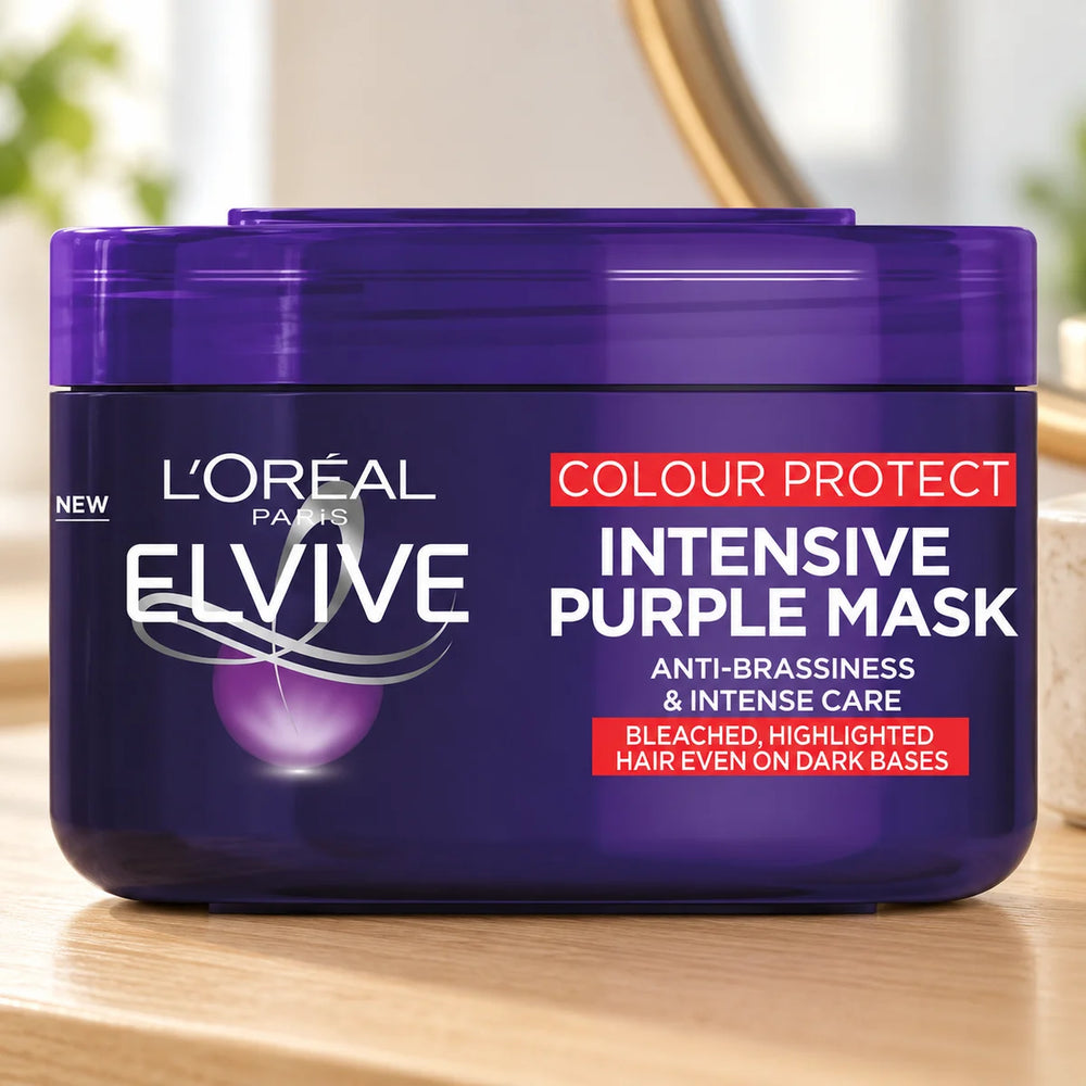 L'Oréal Elvive Colour Protect Anti-Brassiness Purple Mask 250 gm for Blonde, Bleached & Highlighted Hair on a bathroom vanity or dressing table.