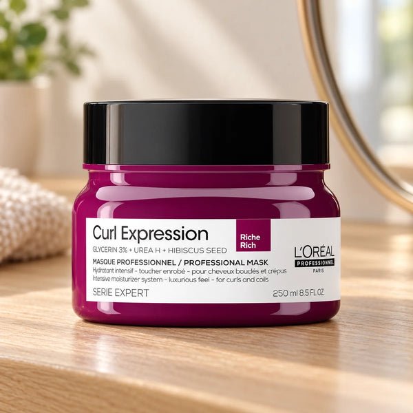 L'Oréal Professionnel Serié Expert Curl Expression Mask Intensely Nourishing & Defining for Curly & Coily Hair — 250 ml on a bathroom vanity or dressing table.