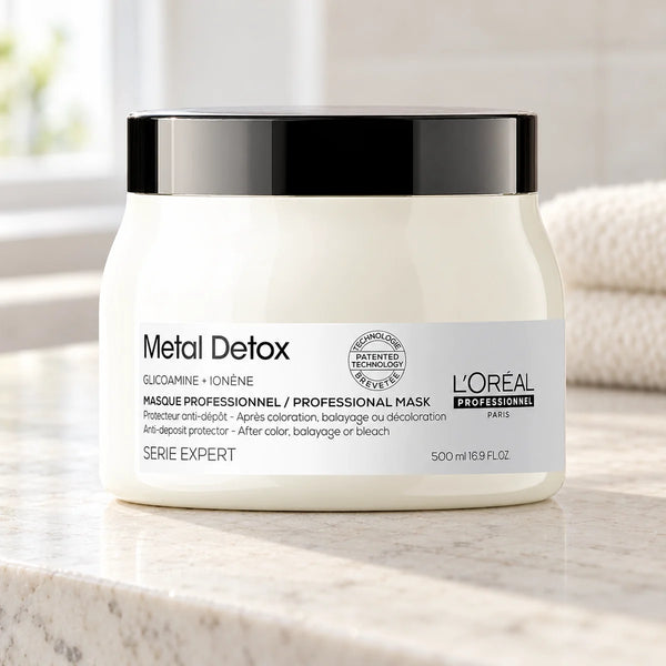 L'Oréal Professionnel Serié Expert Metal Detox Anti-Deposit Protector & Shine-Enhancing Hair Mask for All Hair Types — 500 ml on a bathroom vanity or dressing table.