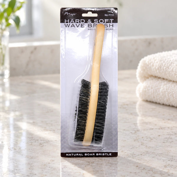 Magic Collection Hard & Soft Wave Brush (No.7713) for Superior Wave Definition & Training for All Hair Types on a bathroom vanity or dressing table.