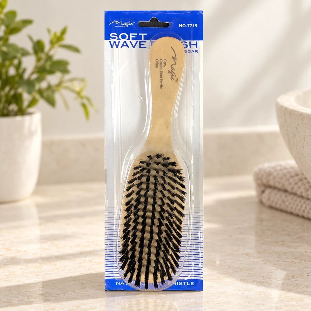 Magic Collection Soft Wave Brush (No.7719) for Superior 360 Wave Definition & Training on a bathroom vanity or dressing table.