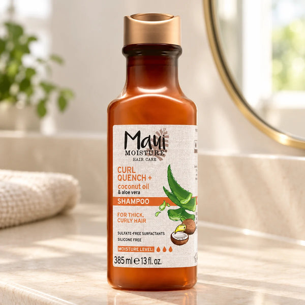 Maui Moisture Curl Quench + Coconut Oil Shampoo — 385 ml on a bathroom vanity.