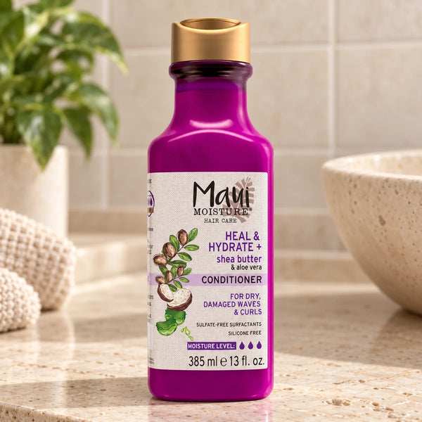 Maui Moisture Hydrate + Shea Butter Conditioner — 385 ml on a bathroom vanity.