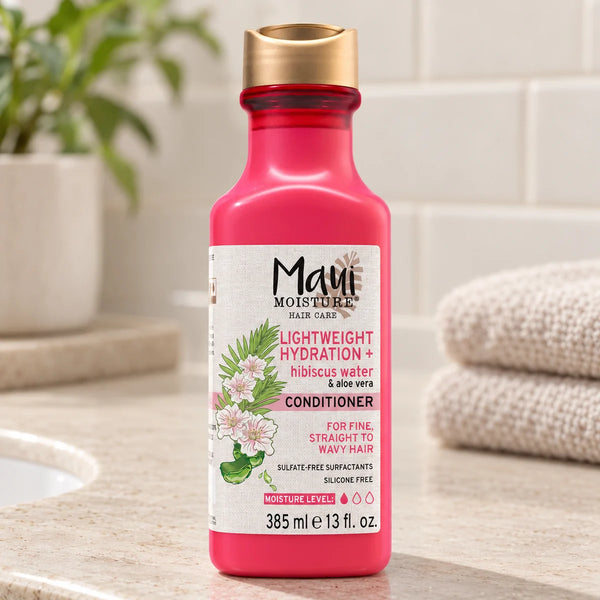 Maui Moisture Lightweight Hydration + Hibiscus Water Conditioner — 385 ml on a bathroom vanity.