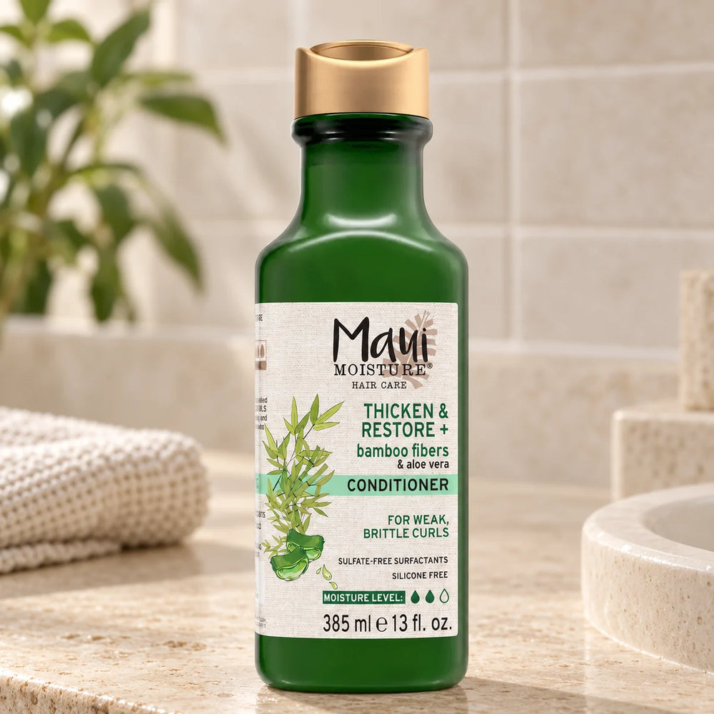 Maui Moisture Thicken & Restore + Bamboo Fiber Conditioner — 385 ml on a bathroom vanity.