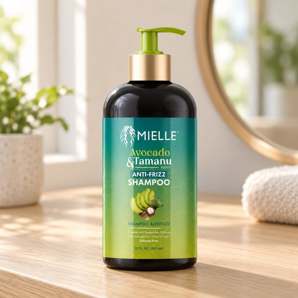 Mielle Avocado & Tamanu Anti-Frizz Shampoo — 12 oz on a bathroom vanity.