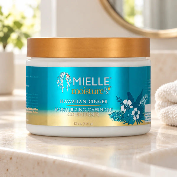 Mielle Hawaiian Ginger Overnight Conditioner — 12 oz on a bathroom vanity.