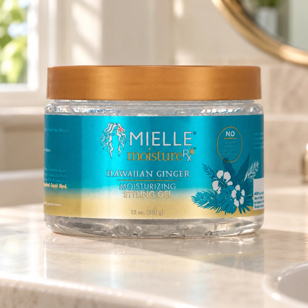 Mielle Hawaiian Ginger Styling Gel — 12 oz on a bathroom vanity.