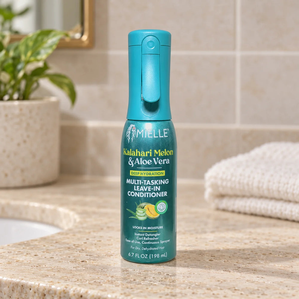 Mielle Kalahari Melon & Aloe Vera Deep Hydration Multi-Tasking Leave-In Conditioner — 198 ml on a bathroom vanity.