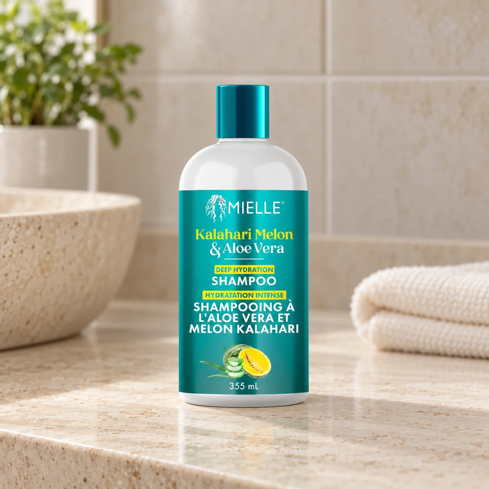 Mielle Kalahari Melon & Aloe Vera Deep Hydration Shampoo — 355 ml on a bathroom vanity.