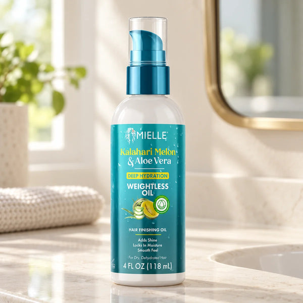 Mielle Kalahari Melon & Aloe Vera Deep Hydration Weightless Oil Moisture & Shine for Dry Hair — 118 ml on a bathroom vanity.