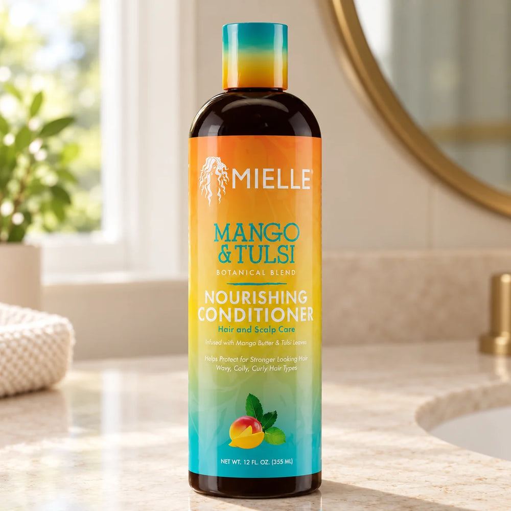 Mielle Mango & Tulsi Nourishing Conditioner — 12 oz on a bathroom vanity.