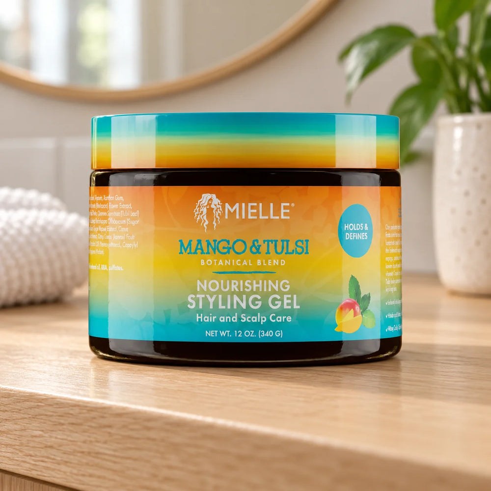 Mielle Mango & Tulsi Nourishing Styling hair Gel — 12 oz on a bathroom vanity.