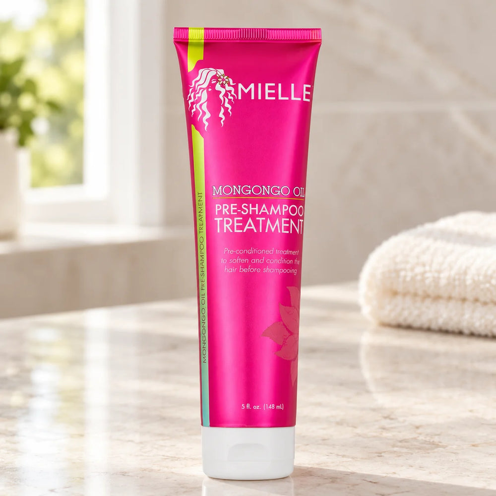 Mielle Mongongo Oil Pre-Shampoo Treatment — 148 ml on a bathroom vanity.