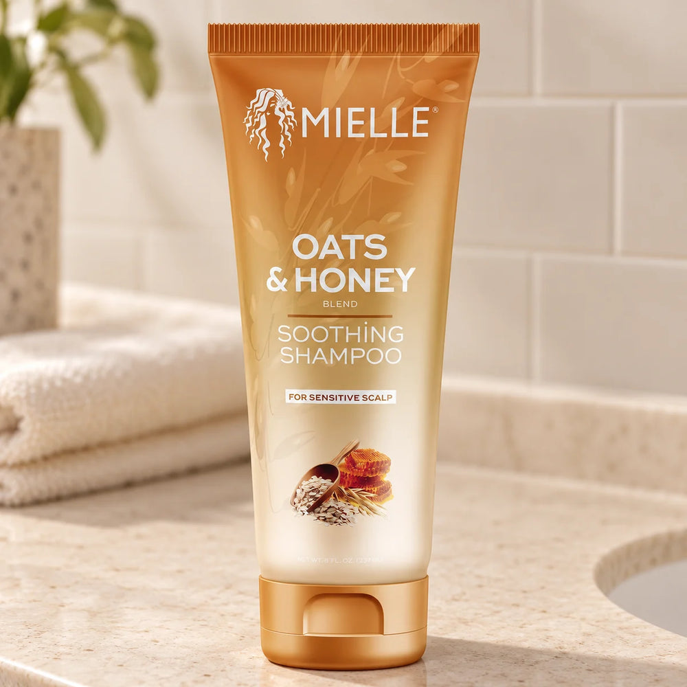 Mielle Oats & Honey Soothing Shampoo — 8 oz on a bathroom vanity.