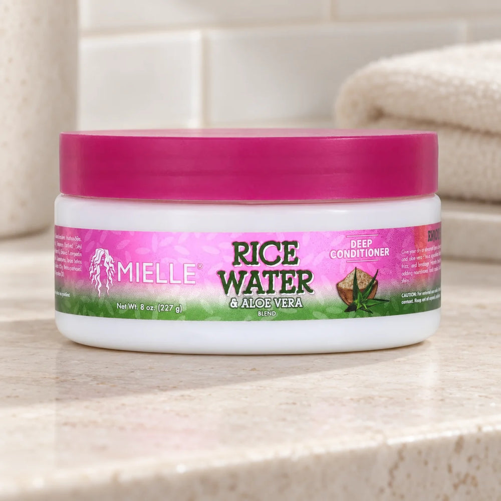 Mielle Rice Water & Aloe Deep Conditioner — 8 oz on a bathroom vanity.