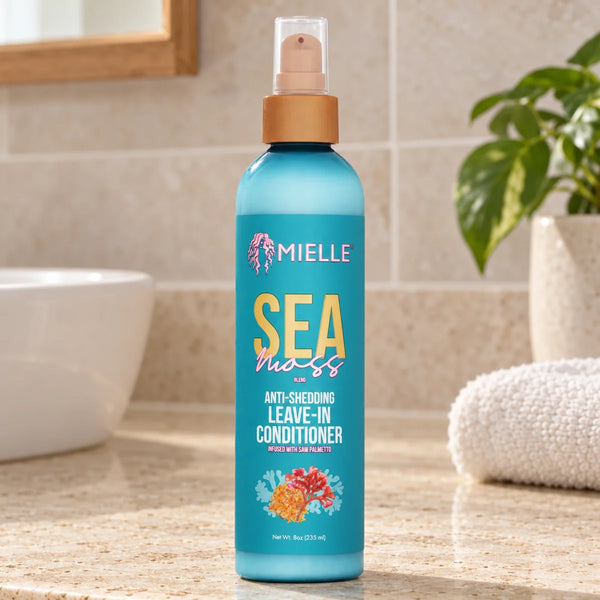 Mielle Sea Moss Leave-In Conditioner — 8 oz on a bathroom vanity.