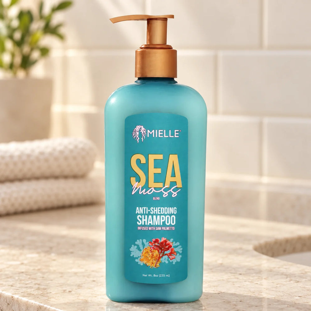 Mielle Sea Moss Shampoo — 8 oz on a bathroom vanity.