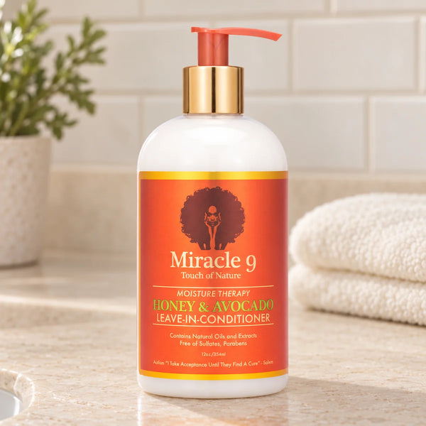 Miracle 9 Moisture Therapy Honey & Avocado Leave-In Conditioner Frizz-Free Hydration for Dry Hair — 12 oz on a bathroom vanity.