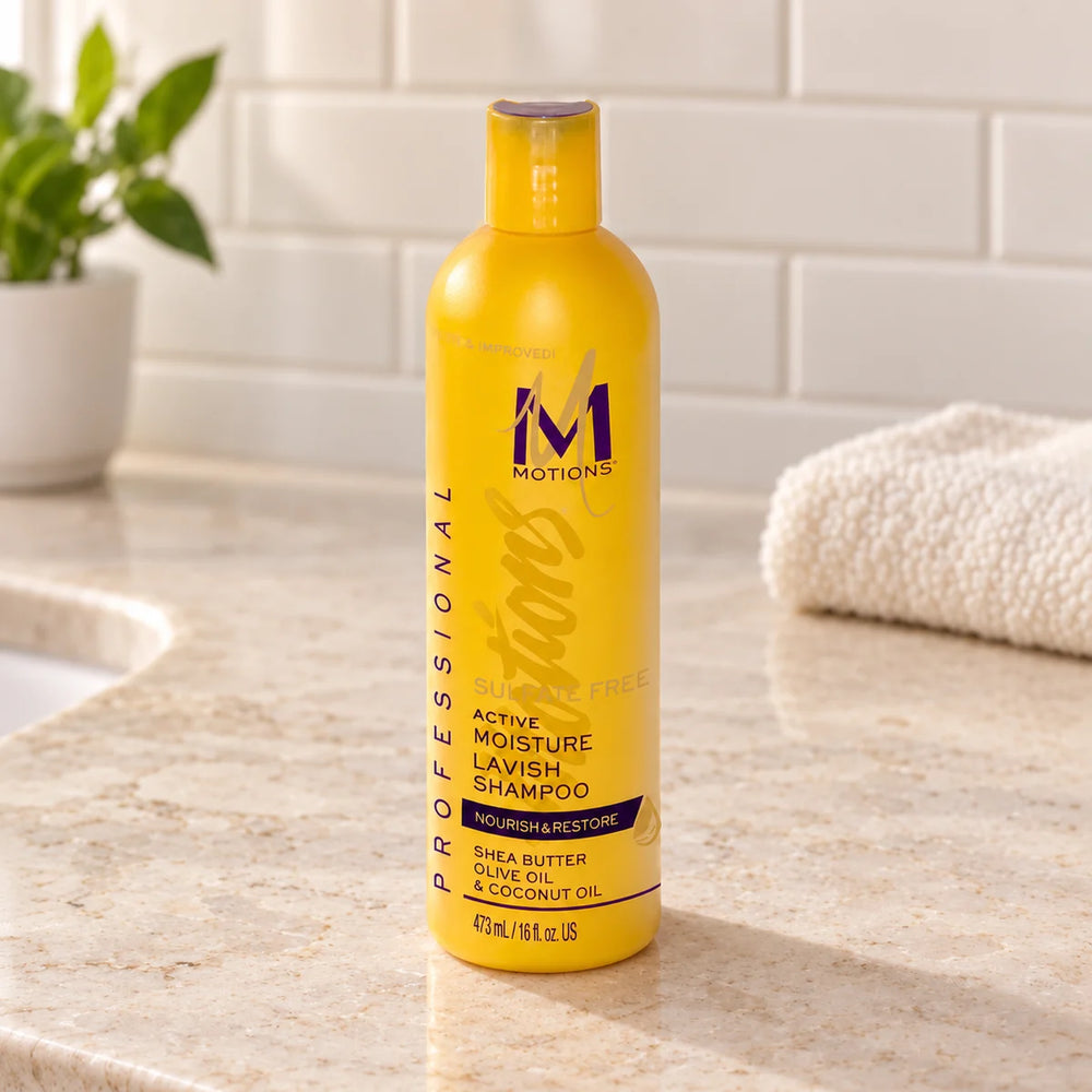 Motions Nourish & Restore Active Moisture Lavish Shampoo - Deeply Hydrating & Strengthening for Dry, Damaged Hair — 16 oz on a bathroom vanity.