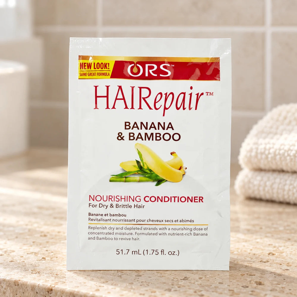 ORS HAIRepair Nourishing Conditioner — 1.75 oz on a bathroom vanity.