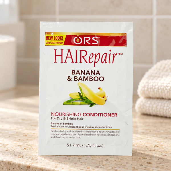ORS HAIRepair Nourishing Conditioner — 1.75 oz on a bathroom vanity.