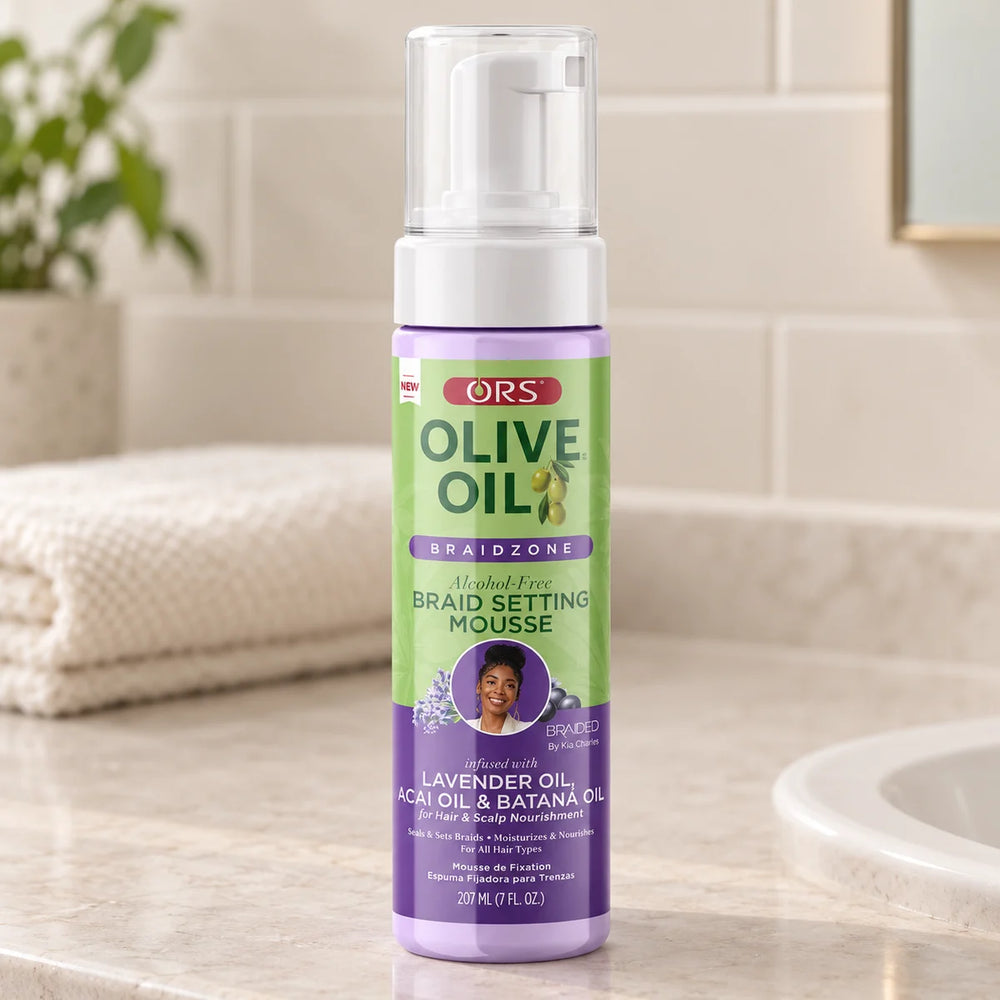 ORS Olive Oil Braidzone Alcohol-Free Braid Setting Mousse — 207 ml on a bathroom vanity.