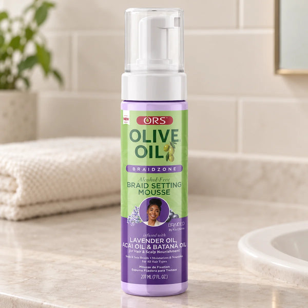 ORS Olive Oil Braidzone Alcohol-Free Braid Setting Mousse — 207 ml on a bathroom vanity.