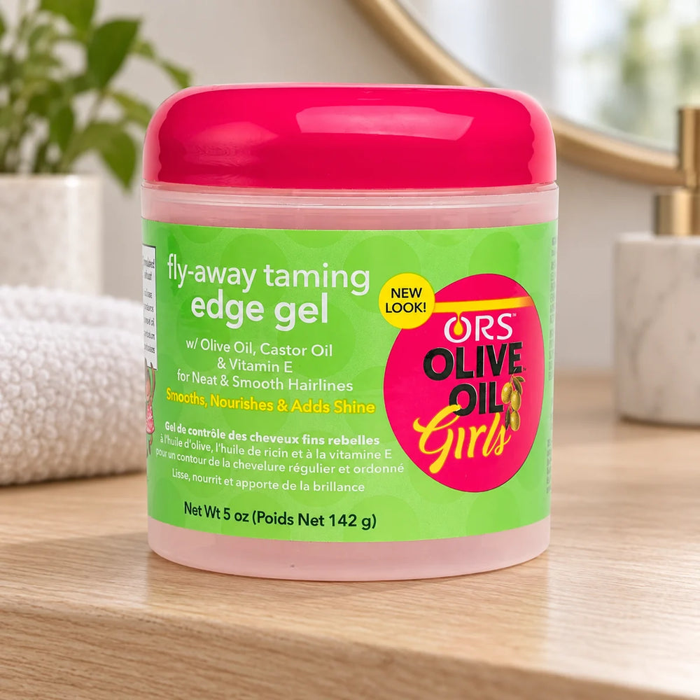 ORS Olive Oil Girls Fly-Away Taming Edge Gel 5 oz For Sleek Edges — 5 oz on a bathroom vanity.