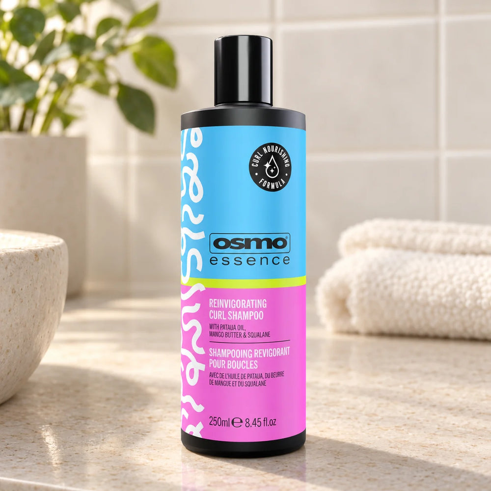 OSMO Essence Reinvigorating Curl Shampoo Defines & Hydrates Curls for Curly & Wavy Hair — 250 ml on a bathroom vanity.