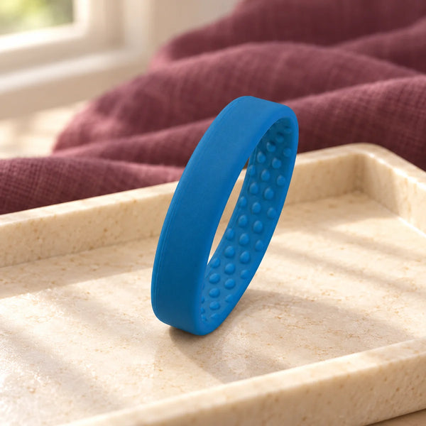 PONY-O Small Hair Fastener — Sapphire on a dressing-table tray.
