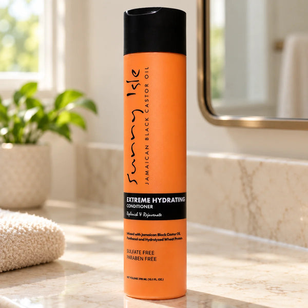 Sunny Isle Jamaican Black Castor Oil Extreme Hydrating Conditioner — 10.1 oz on a bathroom vanity.