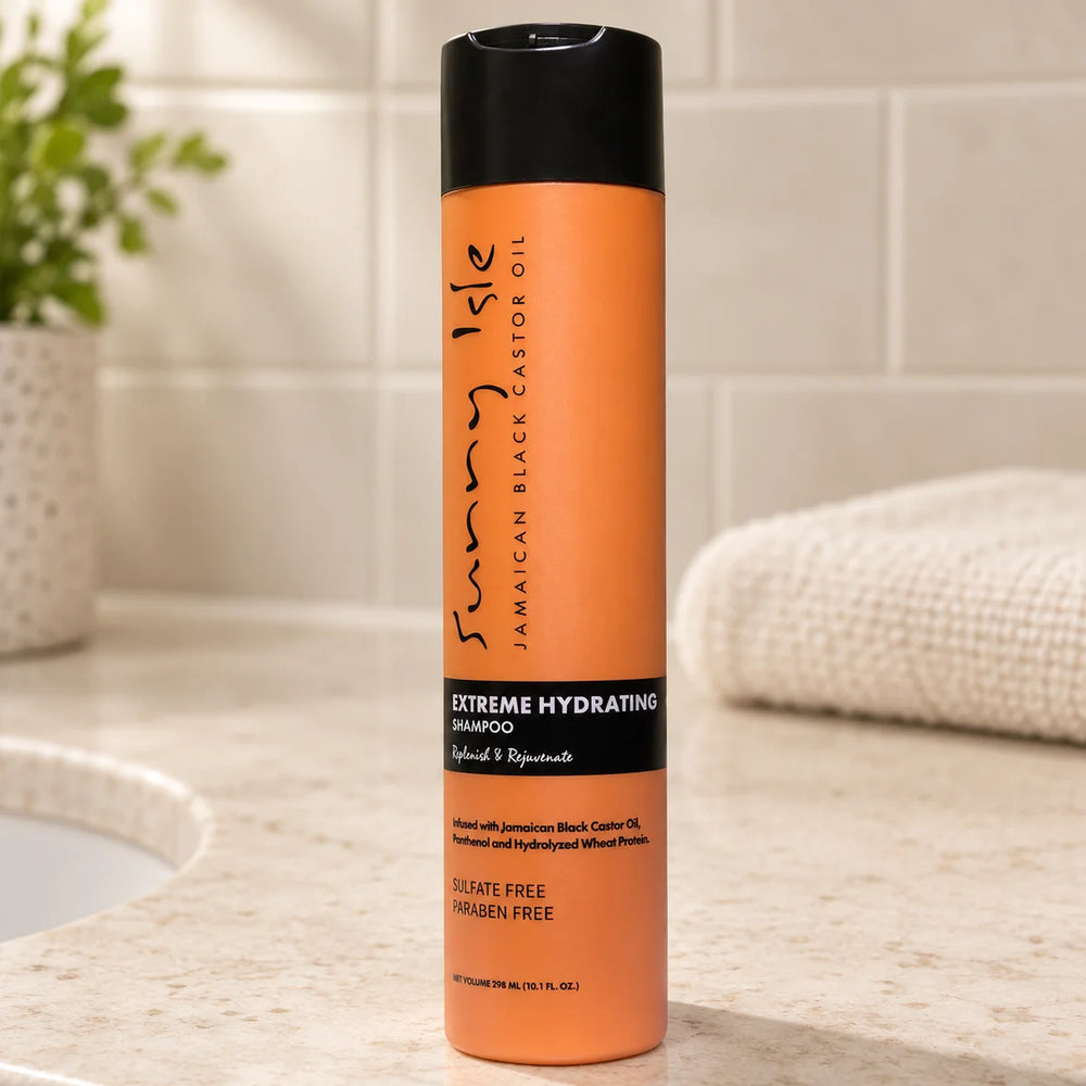 Sunny Isle Jamaican Black Castor Oil Extreme Hydrating Shampoo — 10.1 oz on a bathroom vanity.