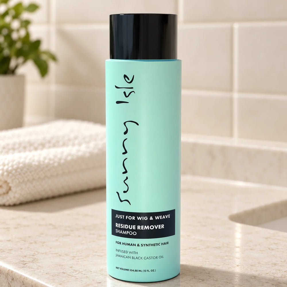 Sunny Isle Just For Wig | Residue Remover Shampoo — 12 oz on a bathroom vanity.