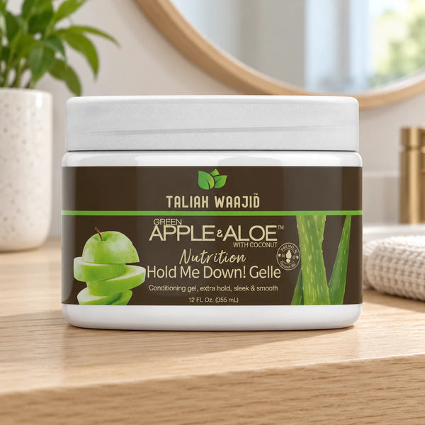 Taliah Waajid Green Apple & Aloe Nutrition Hold Me Down Gelle Strong Hold & Nourishment for All Hair Types — 12 oz on a bathroom vanity.