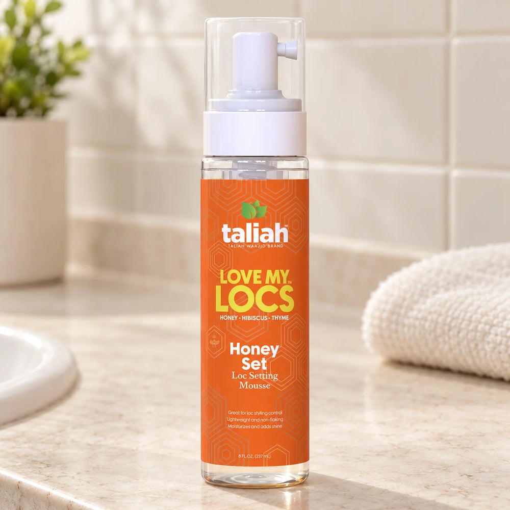 Taliah Waajid Love My Locs Honey Set Loc Setting Mousse Defines & Hydrates Locs — 8 oz on a bathroom vanity.