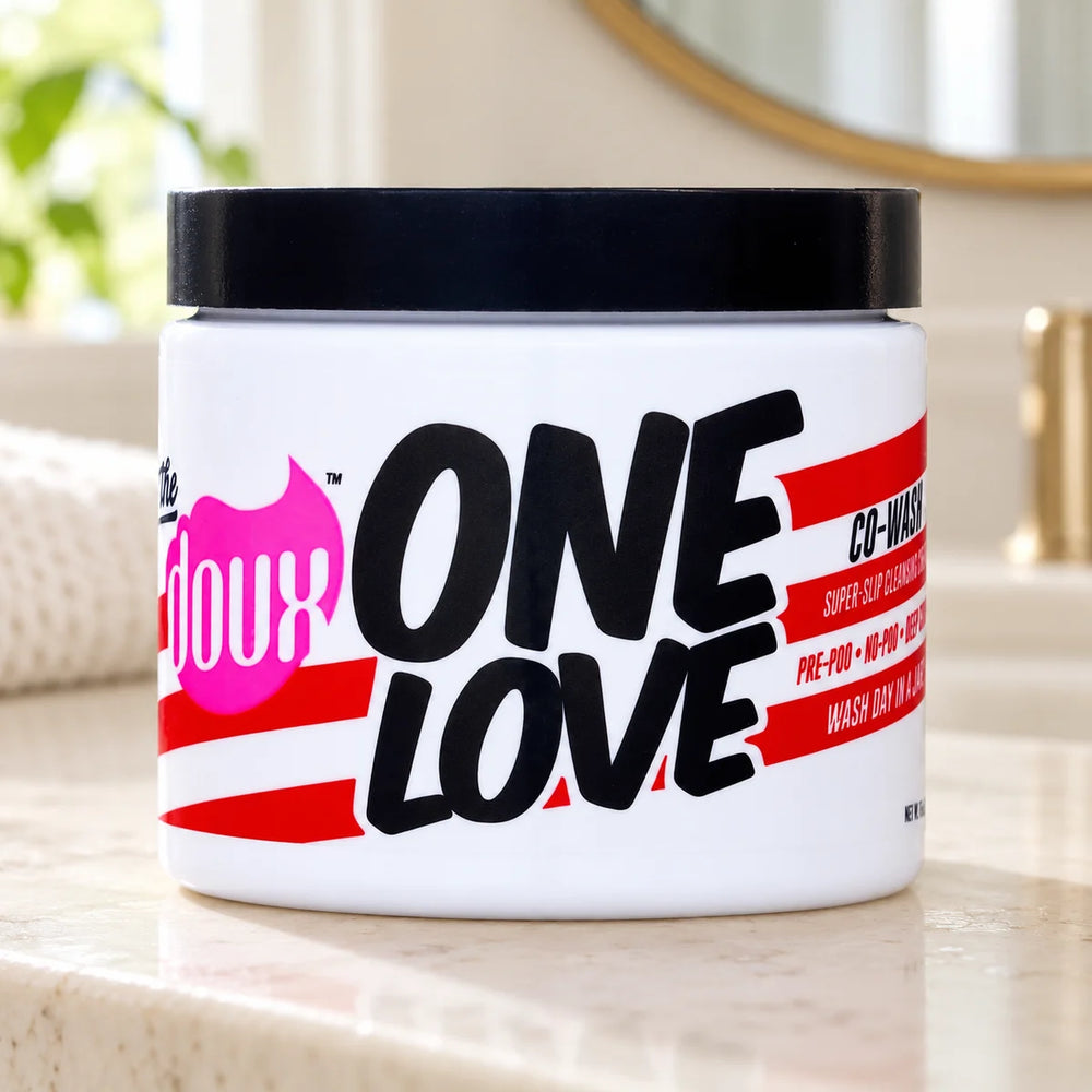 The Doux One Love Co-Wash 16oz Cleansing Conditioner for Curls — 16 oz on a bathroom vanity.