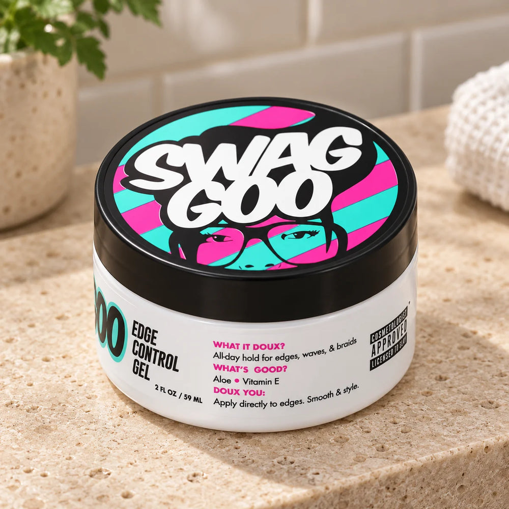 The Doux Swag Goo Edge Control Gel 2oz For Sleek Edges & Natural Hair — 2 oz on a bathroom vanity.
