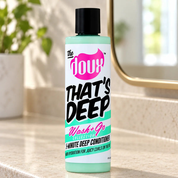 The Doux That's Deep 5-Minute Deep Conditioner 8oz For Curly & Coily Hair — 8 oz on a bathroom vanity.