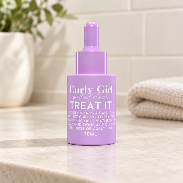Treat It 30ml conditioning oil bottle on a bathroom vanity.