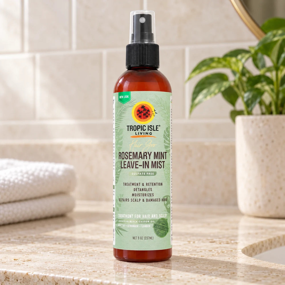 Tropic Isle Living Hair Gro Rosemary Mint Leave-In Mist — 237 ml on a bathroom vanity.