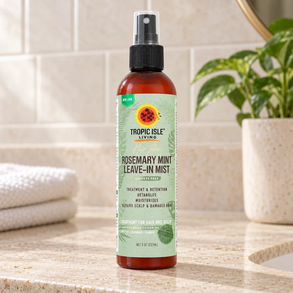 Tropic Isle Living Hair Gro Rosemary Mint Leave-In Mist — 237 ml on a bathroom vanity.